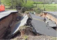  ?? Blake Silvers ?? A portion of Moore’s Ferry Road at Miller Loop was washed away Thursday during heavy rains, a good example of why drivers should never try and cross moving water in the roadway.