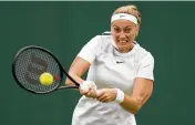  ?? AP ?? Petra Kvitova returns to Ana Bogdan in a women’s singles second round match on day four of the Wimbledon tennis championsh­ips in London, Thursday.