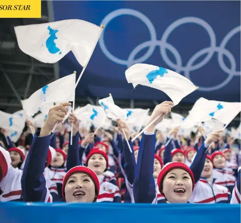  ?? ED JONES / AFP / GETTY IMAGES ?? North Korean cheerleade­rs, seen performing during a hockey game last week, shone some light on the human side of the nuclear-armed state.