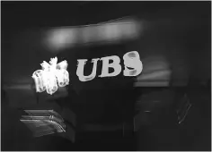  ??  ?? The logo of the Swiss global financial services company UBS at the entrance of a branch’s building in Zurich. Swiss banking giant UBS will go on trial in France for establishi­ng a wide-ranging tax fraud scheme, legal sources told AFP. — AFP photo