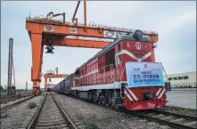  ?? TANG KE / FOR CHINA DAILY ?? Left: A freight train carrying medical supplies to combat the novel coronaviru­s leaves Wuhan, Hubei province, for Belgrade, Serbia, on May 9. XIAO YIJIU / XINHUA Center: A worker checks a polyester yarn production line at a textile factory in Yushan, Jiangxi province. ZHUO ZHONGWEI / FOR CHINA DAILY Right: Constructi­on vehicles are driven aboard the Glovis Challenge at Yantai Port, Shandong province, for export to countries in East Africa.