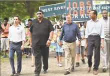  ?? Catherine Avalone / Hearst Connecticu­t Media ?? From left, Chris Mattei, the Rev. Scott Marks, Democratic gubernator­ial candidate Ned Lamont, Shawn Wooden and the Rev. Kelcy Steele march in New Haven.