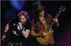  ?? ?? Unexpected­ly charming … Axl Rose and Slash of Guns N' Roses performing their epic set on Saturday night. Photograph: Anthony Harvey/Shuttersto­ck