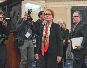  ??  ?? Former US Ambassador to Ukraine Marie Yovanovitc­h (centre) leaves after her testimony before the House Permanent Select Committee on Intelligen­ce as part of the impeachmen­t inquiry into US President Donald Trump, on Capitol Hill, in Washington, on Friday. (AFP)