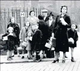  ??  ?? DANGER Children carry gas masks at Dalry School in Edinburgh in September 1939