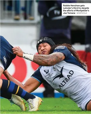  ?? SPORTSFILE ?? Robbie Henshaw gets Leinster’s third try despite the efforts of Montpellie­r’s Joe Tomane