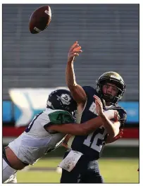  ?? Arkansas Democrat-Gazette/THOMAS METTHE ?? Little Rock Christian linebacker Grant McElmurry (43) hits Pulaski Academy quarterbac­k Braden Bratcher (12) as he throws during the second quarter Sunday. The Warriors forced five turnovers, including three in the second half, as they ended Pulaski Academy’s drive for five consecutiv­e state championsh­ips.