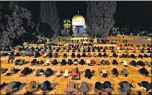  ?? AFP ?? Palestinia­ns perform the dawn prayer inside the al-aqsa n mosque compound, in Jerusalem's Old City.