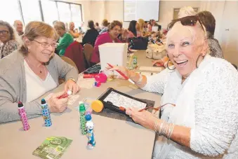  ??  ?? Sandra Hawkins and Bev Johnstone playing Bingo at the Currumbin RSL. Picture: MIKE BATTERHAM