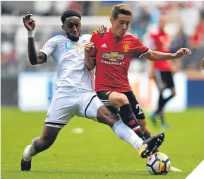  ??  ?? Leroy Fer (left) and Ander Herrera battle for possession.