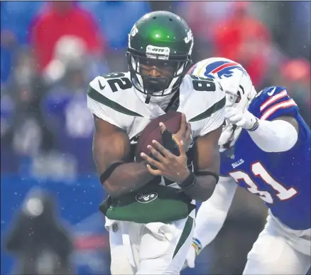  ?? THE ASSOCIATED PRESS ?? File-New York Jets wide receiver Jamison Crowder (82) catches a pass for a touchdown in front of Buffalo Bills’ Dean Marlowe (31) during the second half of an NFL football game Sunday, Dec. 29, 2019, in Orchard Park, N.Y. New York Jets wide receivers Breshad Perriman and Crowder sat out practice Wednesday, Sept. 23, 2020, with injuries, and they could miss the team’s game at Indianapol­is on Sunday.