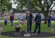  ??  ?? Officials raise the flag during Oneida’s 9/11 Memorial Ceremony.