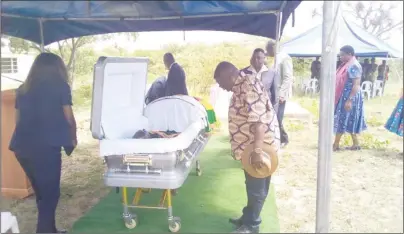  ?? - Picture by George Maponga ?? ZANU-PF National Political Commissar Rtd Lt-Gen Engelbert pays his last respects to national hero Brigadier-General Emilio Munemo at his rural home in Tsaurai Village, Chivi North, before burial at the National Heroes Acre today.