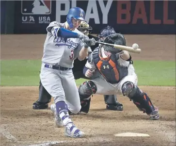  ?? Robert Gauthier Los Angeles Times ?? JOC PEDERSON smashes a three-run home run to cap a five-run ninth-inning outburst to bury Houston.