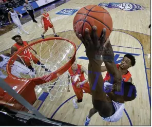  ?? AP/CHUCK BURTON ?? Duke’s Zion Williamson makes one of his five dunks during Thursday’s 84-72 victory over Syracuse in an Atlantic Coast Conference quarterfin­al in Charlotte, N.C. Williamson made all 13 of his shots and finished with 29 points.