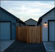  ?? AMANDA LUCIER / THE NEW YORK TIMES ?? Homes are seen Oct. 12 in the Cinder Butte Village housing developmen­t in Redmond, Ore. New homes in the developmen­t are being built much closer together than those constructe­d just a few years ago.