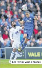  ??  ?? Lee Peltier wins a header.