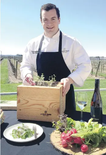  ??  ?? Tim Mackiddie, executive chef at Jackson-Triggs Estate Winery in Niagara-on-the-Lake, Ont., displays some of the produce he grows in five plots on the site for use in the dishes he serves.