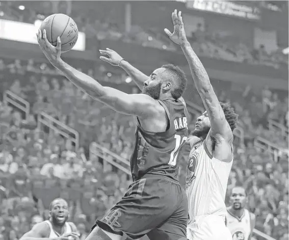  ?? Brett Coomer / Houston Chronicle ?? Guard James Harden goes to the basket, a strategy that worked early before the Rockets were betrayed by miserable long-range shooting in the second half.