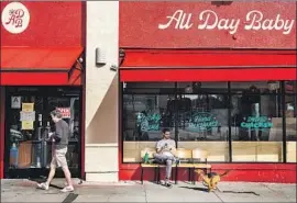  ?? Mariah Tauger Los Angeles Times ?? ALL DAY BABY, which recently opened in Silver Lake, held a sale Tuesday to off load its surplus inventory, including lots of produce, eggs, biscuits and wine.