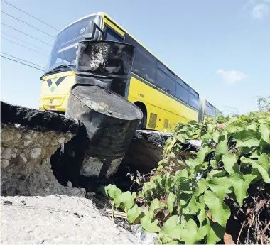  ?? RICARDO MAKYN/MULTIMEDIA PHOTO EDITOR ?? A section of the Spanish Town Bypass that collapsed near the intersecti­on of White Church Street and is in need of urgent repair. Some motorists fear that the breakaway will create greater danger during the hurricane season.