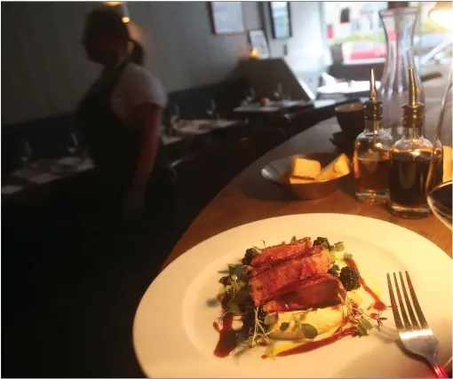  ?? PHOTOGRAPH: GORDON TERRIS ?? Bar seats are a good place to eat at The Rabbit Hole; otherwise it’s tight but cosy