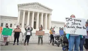  ?? JACK GRUBER/USA TODAY ?? Abortion-rights supporters rally at the Supreme Court on Tuesday after a draft opinion from Justice Samuel Alito was leaked.