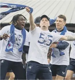  ??  ?? 0 Kent celebrates the title win with Calvin Bassey, left and Ryan Jack