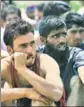  ?? HT FILE ?? Kashmiri youth wait for their turn to take the physical fitness test during a police recruitmen­t drive.