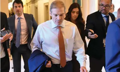  ?? ?? Jim Jordan is followed by reporters as he leaves a closed-door vote to nominate a new speaker. Photograph: Saul Loeb/AFP/Getty Images