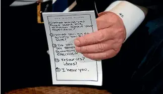  ?? AP ?? A close-up reveals President Trump’s talking points during a listening session about gun control with high school students and teachers.