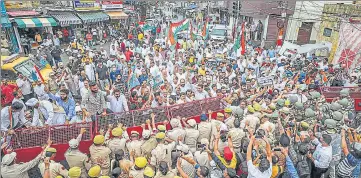  ?? PTI ?? Police personnel try to stop Jammu Kashmir Pradesh Congress Committee leaders during their protest march against the summoning of Congress interim president Sonia Gandhi by Enforcemen­t Directorat­e (ED) for questionin­g in the National Herald case, in Jammu, Thursday.