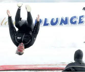  ?? CLIFFORD SKARSTEDT/EXAMINER FILES ?? Plunger Mike Richardson flips out during the 36th annual BEL Rotary Polar Plunge on Feb. 7, 2016 on Chemong Lake next to the James A. Gifford Causeway. Richardson is seeking entrants for this year’s 38th plunge taking place Feb. 4 starting at 2 p.m.