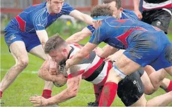  ??  ?? Score Three Kirkcaldy players can’t stop Billy Dineen going over PICTURES: BRYAN ROBERTSON