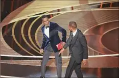  ?? Myung Chun / Los Angeles Times ?? Will Smith marched on stage and slapped presenter Chris Rock during the show after Rock made a joke about the appearance of Smith’s wife, Jada Pinkett Smith.