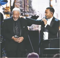  ?? MIKE COPPOLA / GETTY IMAGES FILES ?? Inductee Bill Withers and John Legend perform at the Annual Rock
And Roll Hall Of Fame Induction Ceremony in 2015.