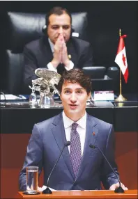  ?? CP PHOTO ?? Mexican Senator Ernesto Cordero looks on as Prime Minister Justin Trudeau delivers a speech to the Mexican Senate in Mexico City on Friday.