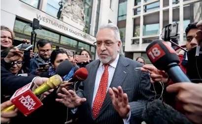  ?? AP ?? Indian businessma­n Vijay Mallya is surrounded by the media as he leaves the Westminste­r Magistrate­s Court in london on Monday. —
