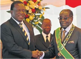  ?? /Reuters ?? Erstwhile mates: Former president Robert Mugabe, right, greets former vice-president and now incoming president Emmerson Mnangagwa in 2015. Both are alleged to have rigged elections.