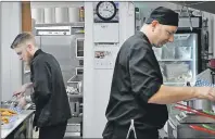  ?? ASHLEY THOMPSON ?? The kitchen staff at the Jonny’s Cookhouse in Berwick kept busy on opening day Feb. 9.