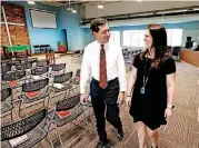  ?? OKLAHOMAN] [PHOTO BY STEVE SISNEY, THE ?? Rev. Paul Kirbas, senior minister of Westminste­r Presbyteri­an Church, and Laurel Hall, Connecting Point Presbyteri­an’s campus minister, are seen in the auditorium of Connecting Point Presbyteri­an.