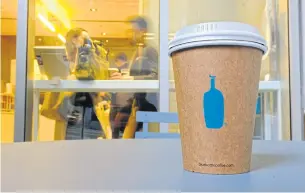  ?? AP ?? Blue Bottle is starting small with plans to stop using paper cups at two of its San Francisco area branches in 2020.