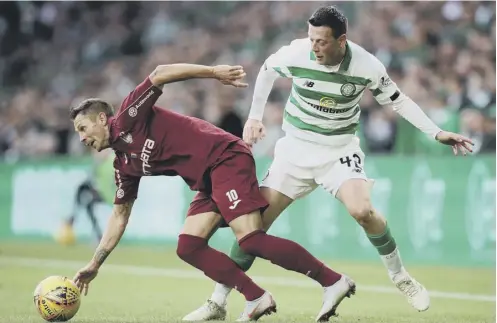  ??  ?? 0
Ciprian Deac of Cluj, left, and Celtic’s Callum Mcgregor contest possession in Tuesday night’s Champions League qualifier.