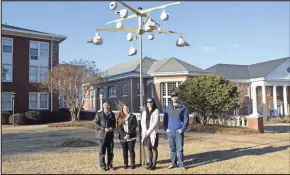  ?? Shorter University, File ?? From left, Shorter University Assistant Professor of Physics Qiang Lu and students Courtney Knight, Jessieca Hannah and J.J. Gilbert stand beneath a rack of purple martin nesting gourds they helped install in Cooper Courtyard in this 2015 file photo.