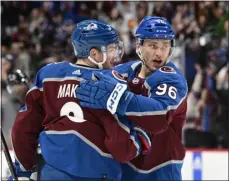  ?? ANDY CROSS — THE DENVER POST ?? Avalanche right wing Mikko Rantanen, right, celebrates his goal against the Ducks with defenseman Cale Makar in the first period at Ball Arena in Denver on Jan. 26.