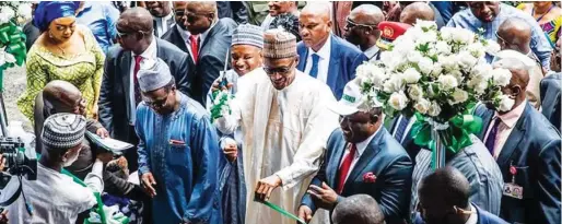  ??  ?? President Muhammadu Buhari commission­ing the Cross River Rice Seedlings Factory