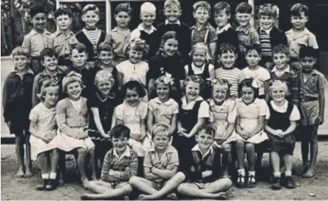  ??  ?? Alan Rickard (second from left in the back row) and the 1952 class at Labrador State School. Note the bare feet.