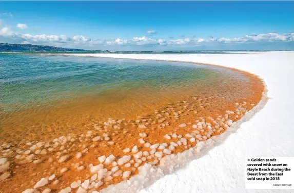  ?? Kieran Brimson ?? Golden sands covered with snow on Hayle Beach during the Beast from the East cold snap in 2018