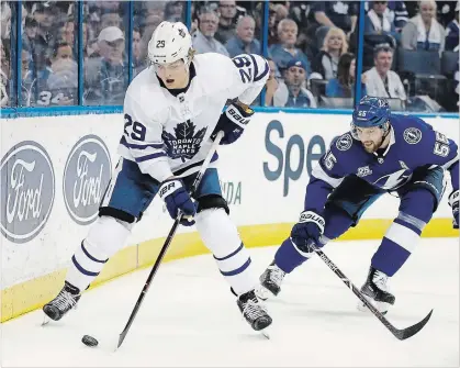  ?? CHRIS O’MEARA THE ASSOCIATED PRESS ?? Toronto Maple Leafs centre William Nylander gets past Tampa Bay Lightning defenceman Braydon Coburn during the first period Tuesday in Tampa, Fla. For the game result, go to our website.