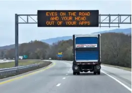  ?? STAFF FILE PHOTO BY TIM BARBER ?? A TDOT informatio­n sign on the Bill Carter Causeway in Soddy-Daisy offers an instructio­nal message for motorists who drive distracted.